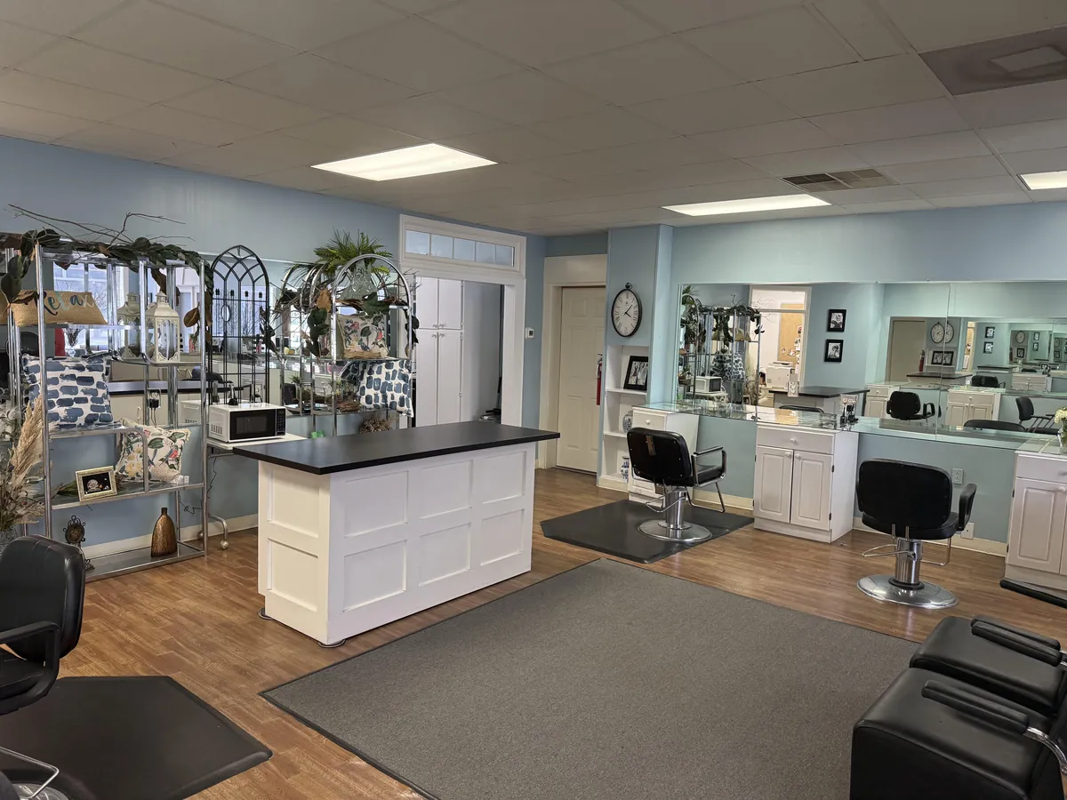 Interior of Kay's Kreations Salon & Co., showing styling chairs, mirrors, and the front reception area