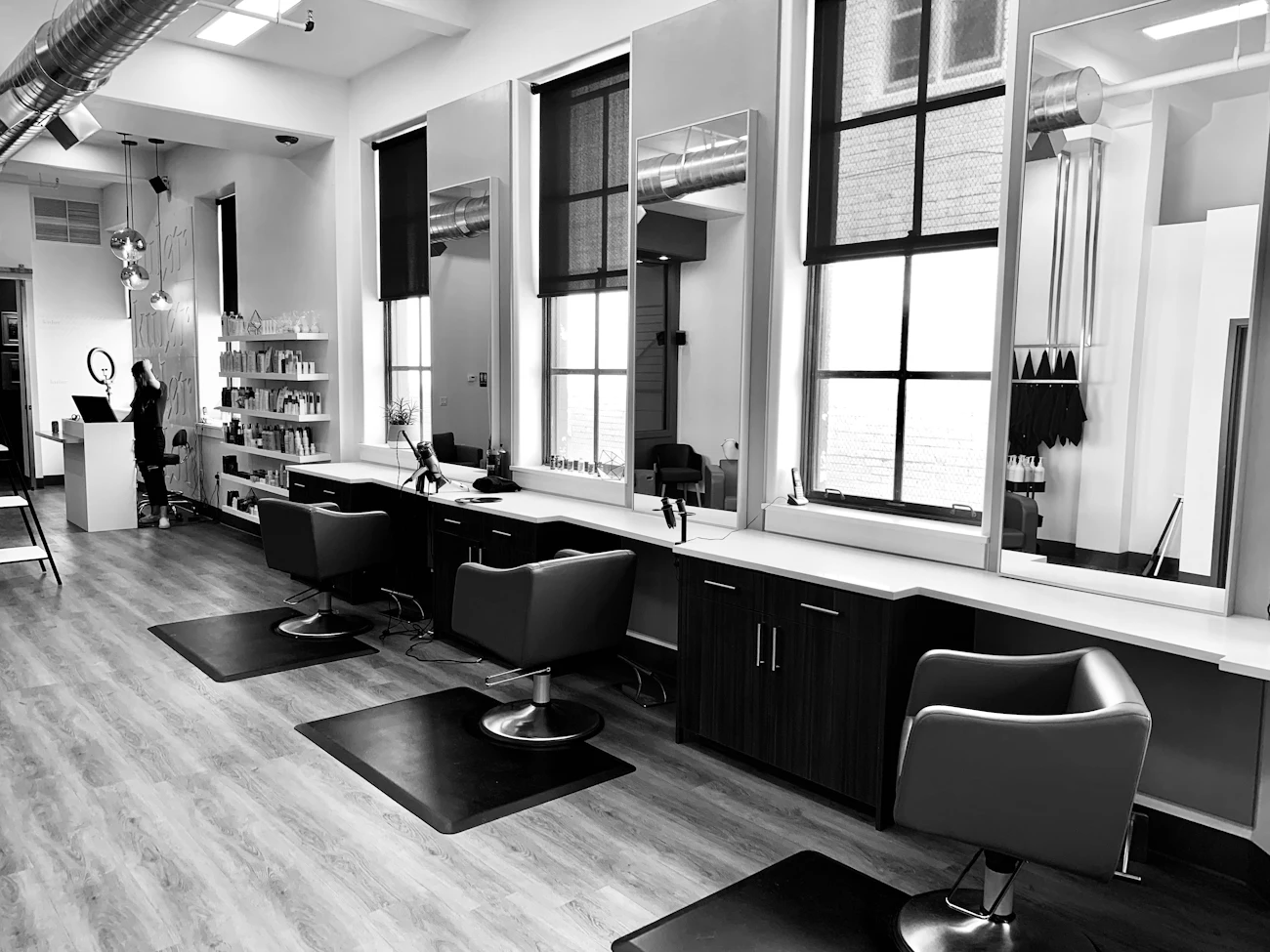 Interior of Kay's Kreations Salon & Co., showing styling chairs and mirrors along a bright window wall